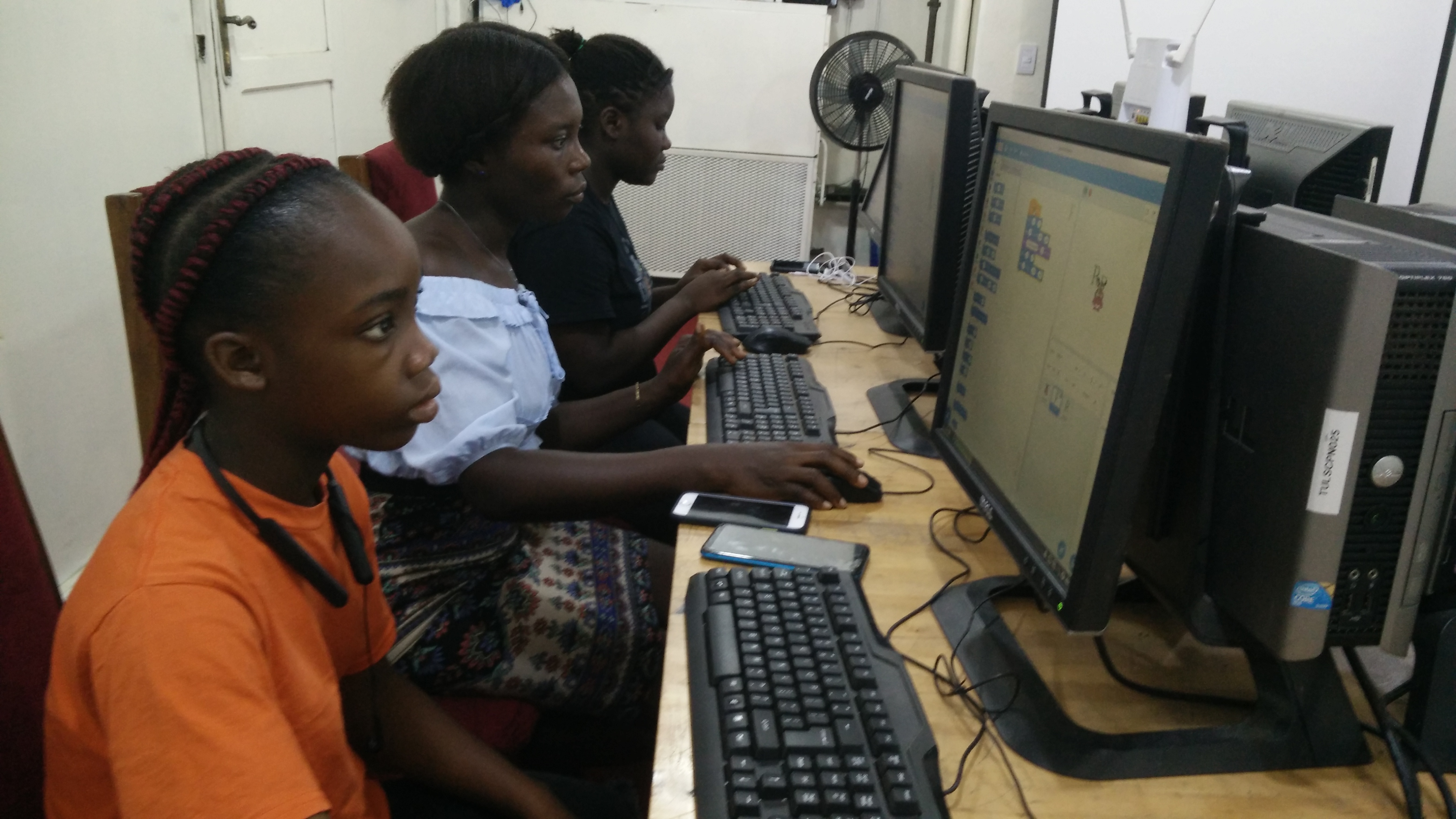 Freena, Comfort, and Aminata programming with Scratch